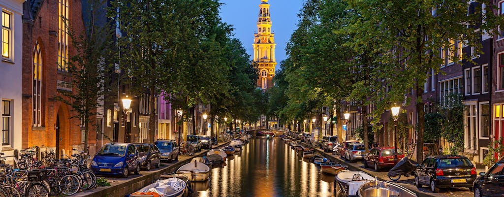 Tour nocturno en español por el Barrio Rojo y paseo en barco por los canales de Ámsterdam