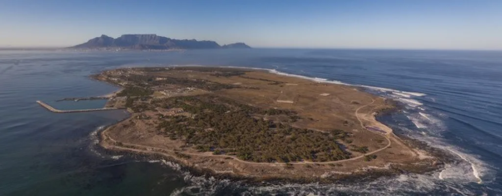 Aerial view of Robben Island with Table Mountain and Cape Town in the background