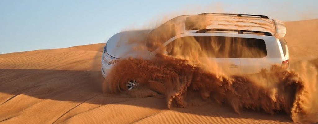 Safari dans le désert rouge de Dubaï avec barbecue, balade en chameau et sandboard