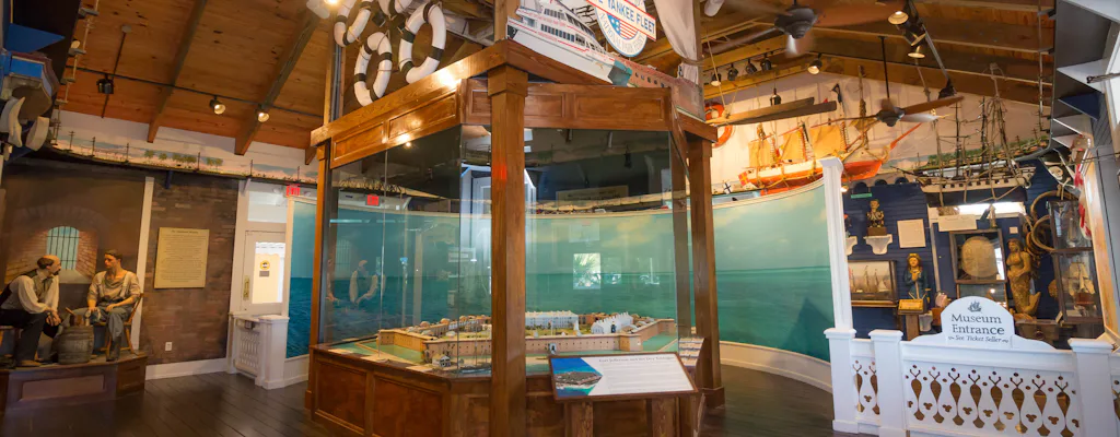 Interior exhibits at the Sails to Rails Museum in Key West with maritime displays and scale model