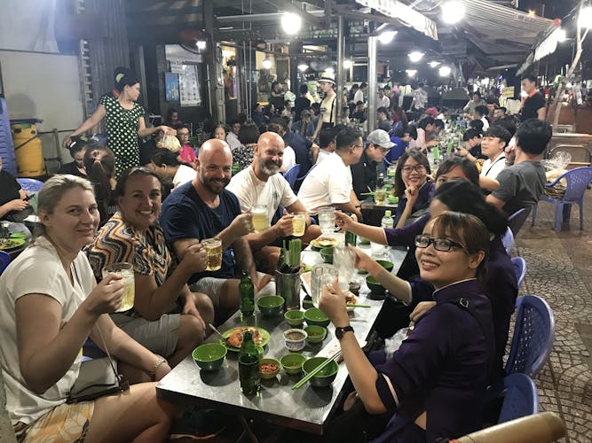 Ho Chi Minh City scooter food tour by night with a local host