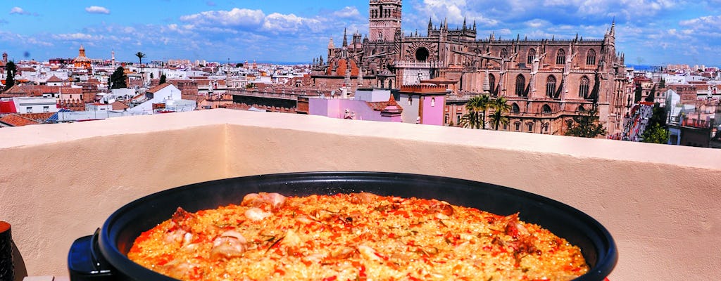 Paella cooking class and dinner on a hidden Seville rooftop