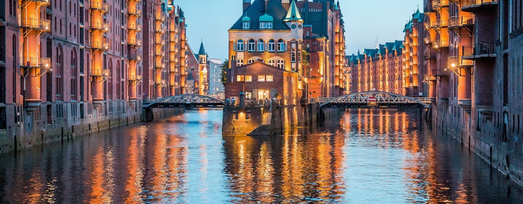 Evening cruise through the illuminated harbor of Hamburg