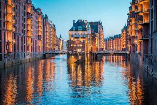 Evening cruise through the illuminated harbor of Hamburg