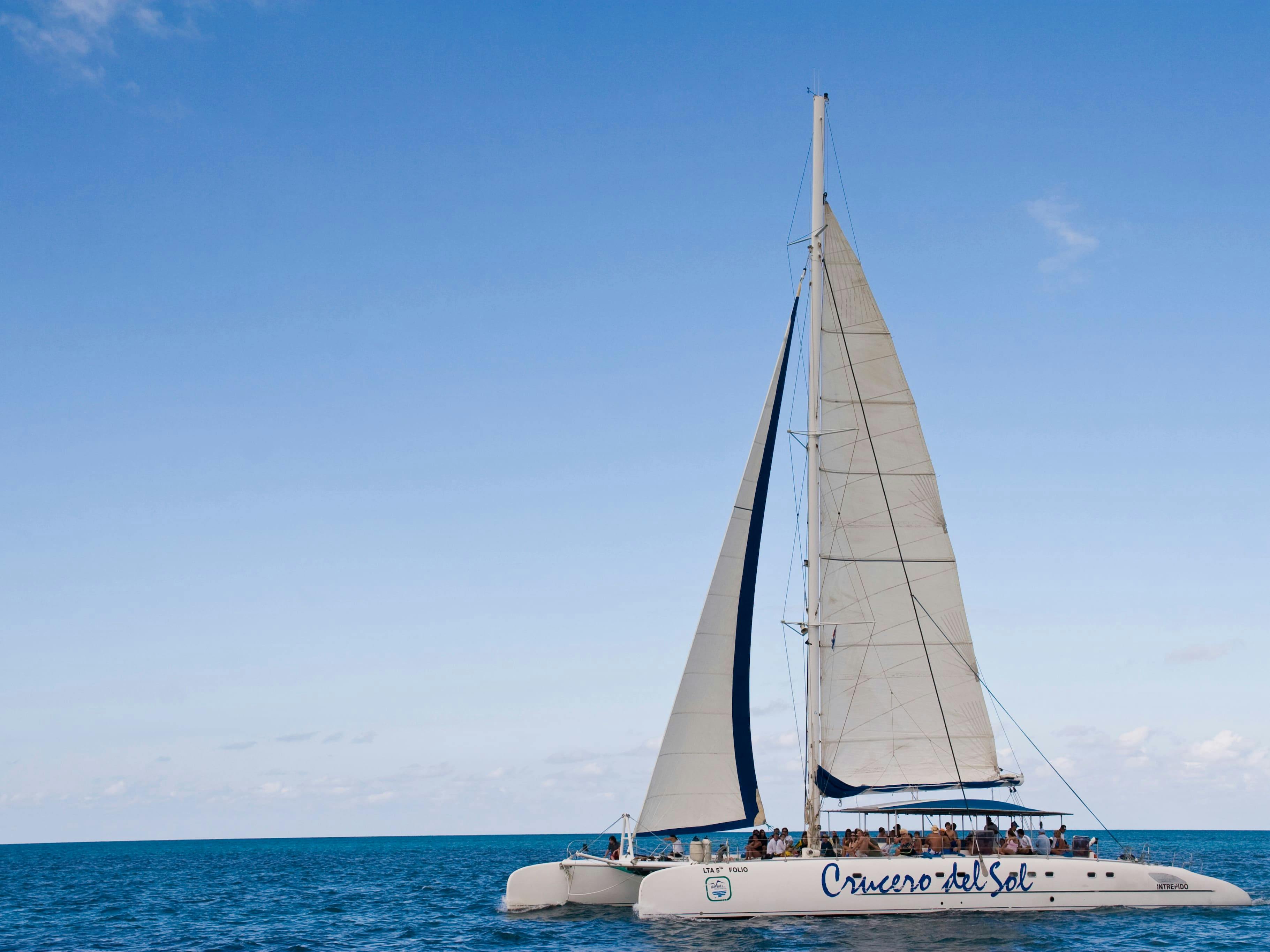 Cayo Blanco catamaran cruise with dolphin encounter