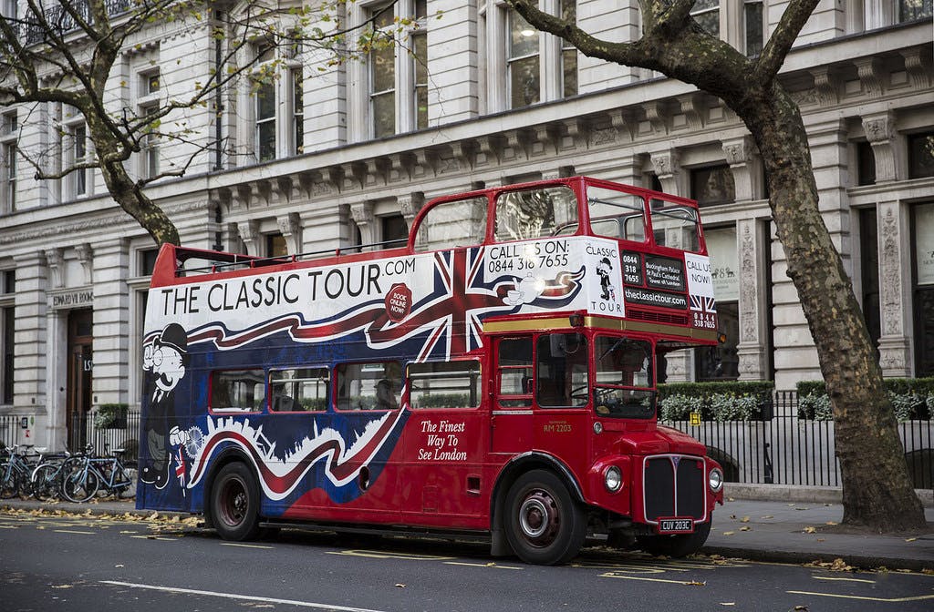 Classic London sightseeing tour in a vintage bus