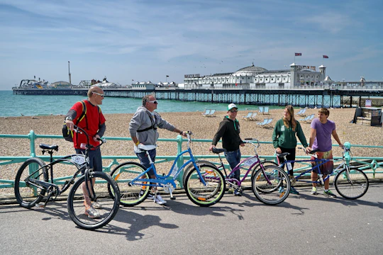 Cycle along the beachfront with Brighton Beach Bikes hire