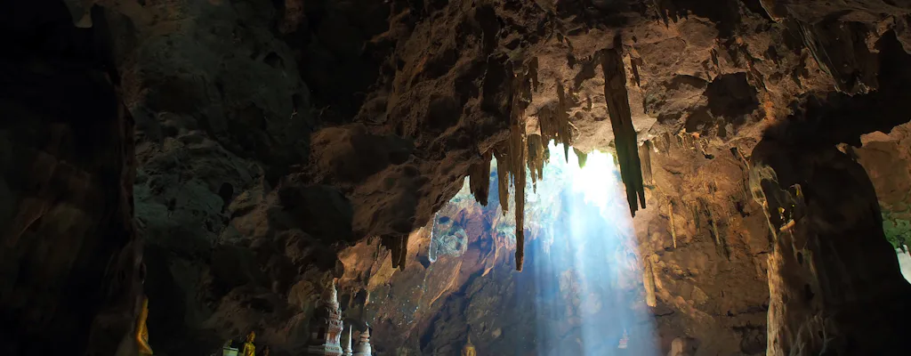 Light streaming into Khao Luang Cave on the Phetchaburi Summer Palace tour from Hua Hin