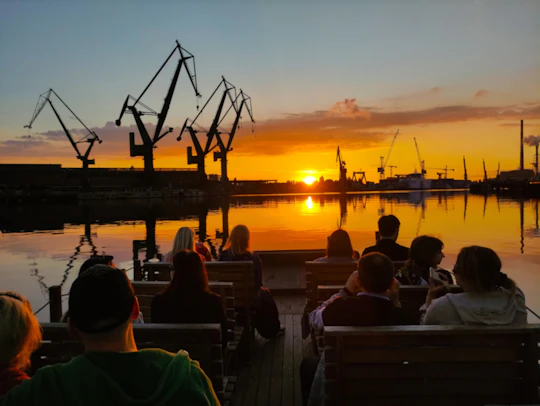 Sunset on the shipyard and old town cruise in Gdansk