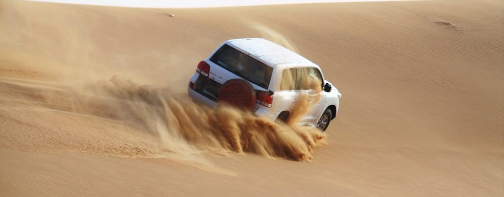 Desert safari, sand boarding, camel ride, and swim from Doha