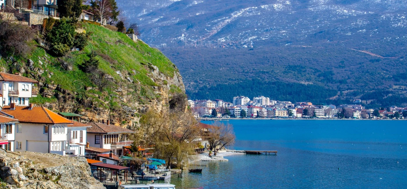 Lake Ohrid shoreline and hillside houses on a day trip from Tirana to Ohrid