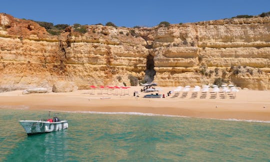 Guided boat trip with extra swimming time and beach BBQ from Albufeira