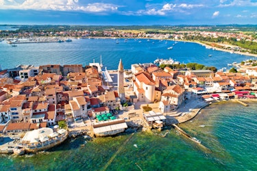 Whitewashed buildings facing the pristine waters of the Adriatic, Umag radiates elegance in all corners.
