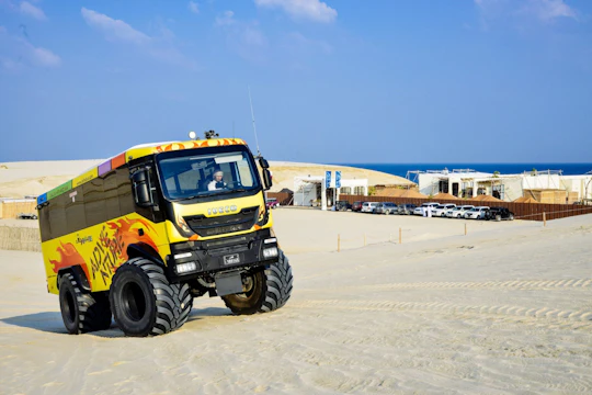 Monster bus tour in the desert with Al Majles Resort day pass
