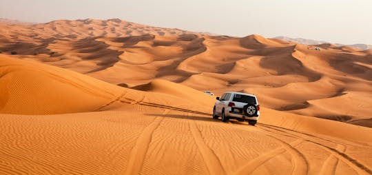 Dubai desert safari with dune bashing, sand boarding, BBQ dinner
