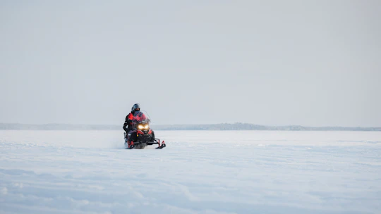 Snowmobile safari through Lappish forest