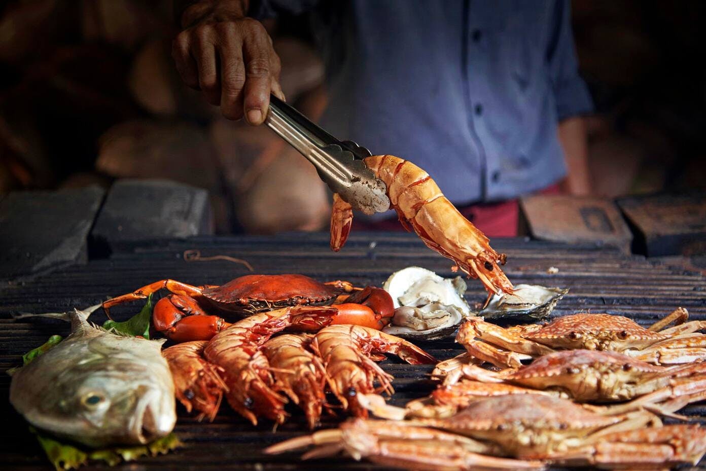 Cena a base di pesce al ristorante Kan Eang