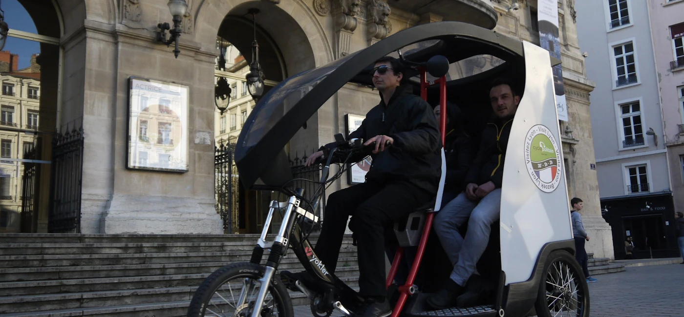 Pedicab (tuk-tuk style) tour in Vieux-Lyon passing historic buildings