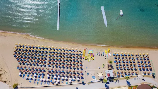 Watersports and beach fun at St Nick's Beach with optional transfers