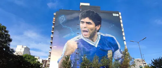Messi and Maradona Argentine football legends graffiti tour