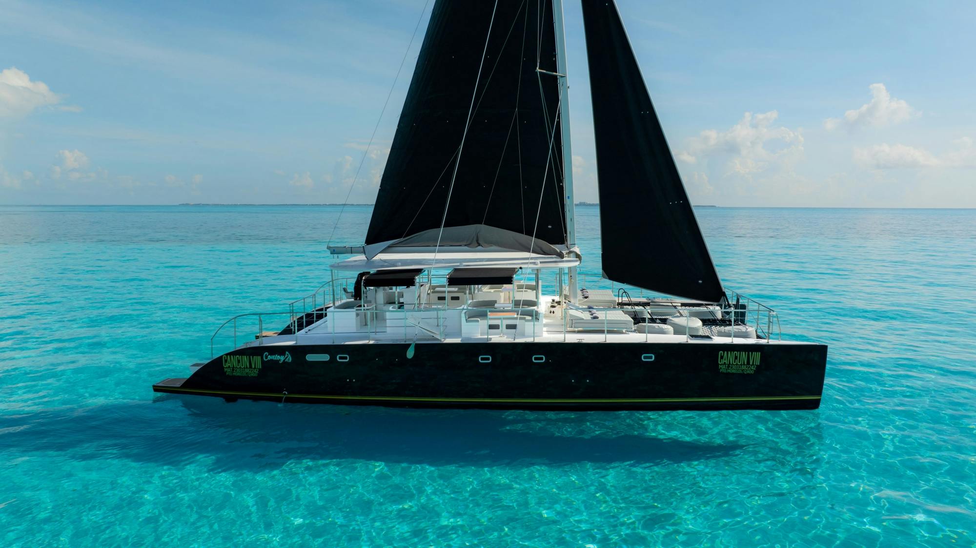 Catamaran cruise to Isla Mujeres with beach club visit and brunch