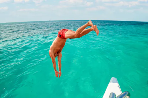 Catamaran cruise to Isla Mujeres with beach club visit and brunch