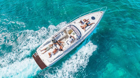 Half-day private cruise to Ibiza's stunning beaches from San Antonio