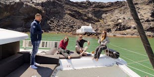 Catamaran cruise along Santorini's coastline from Fira