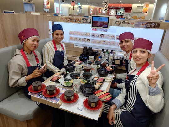 Conveyor belt sushi experience in Osaka