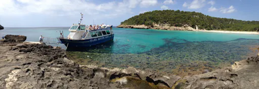Boat cruise from Cala’n Bosch with snorkelling and onboard bar