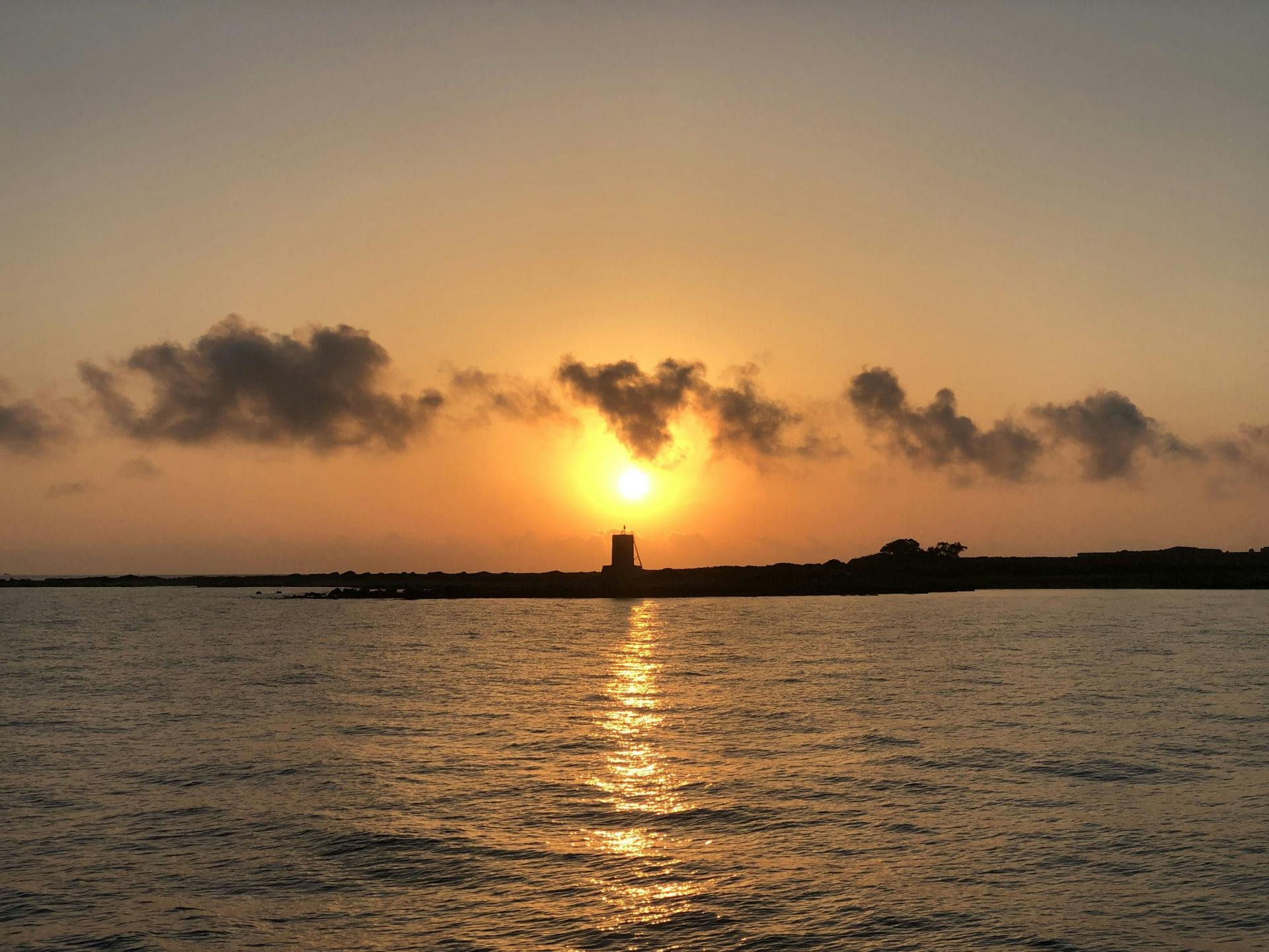 Sunset cruise to Vardiani Island in a traditional Greek boat
