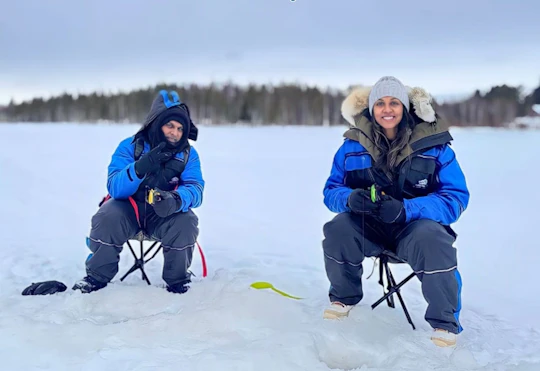 Ice fishing small group experience with BBQ from Rovaniemi