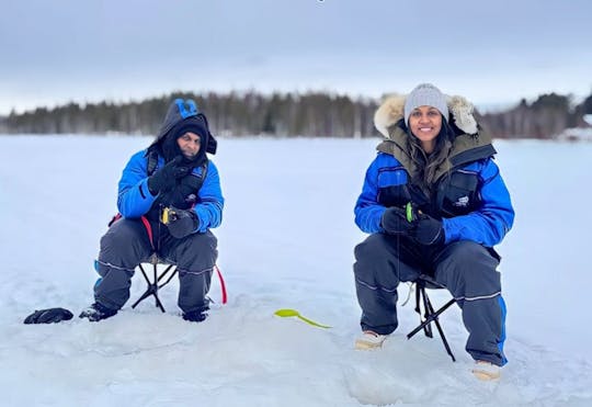 Ice fishing small group experience with BBQ from Rovaniemi