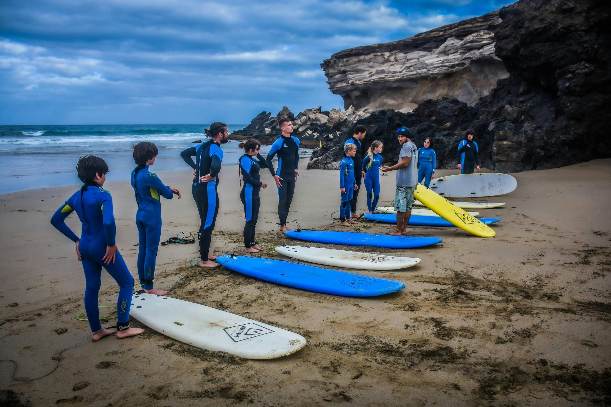 Family surfing session in the south of Fuerteventura