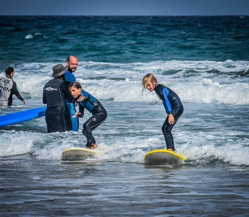 Family surfing session in the south of Fuerteventura