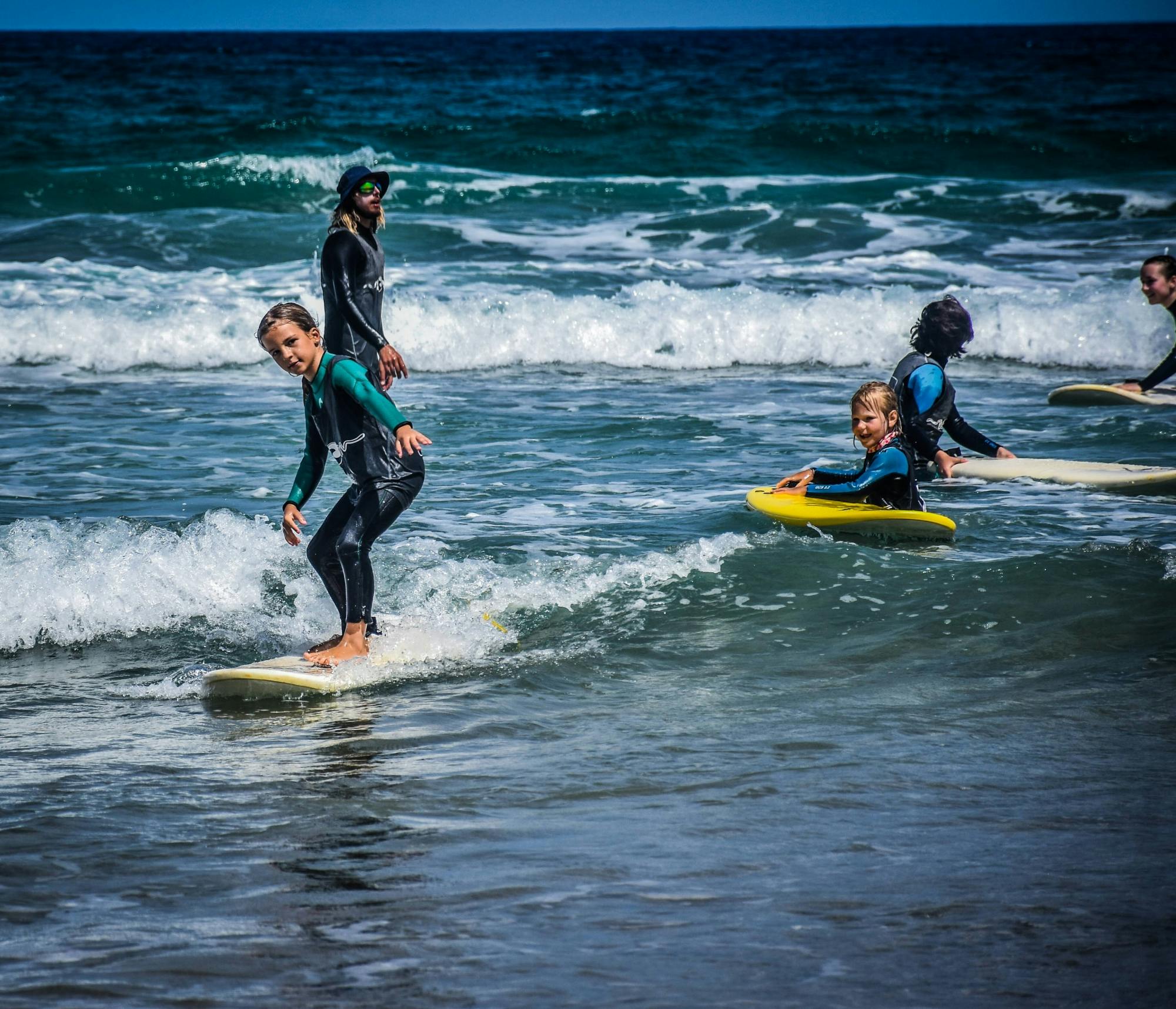 Family surfing session in the south of Fuerteventura