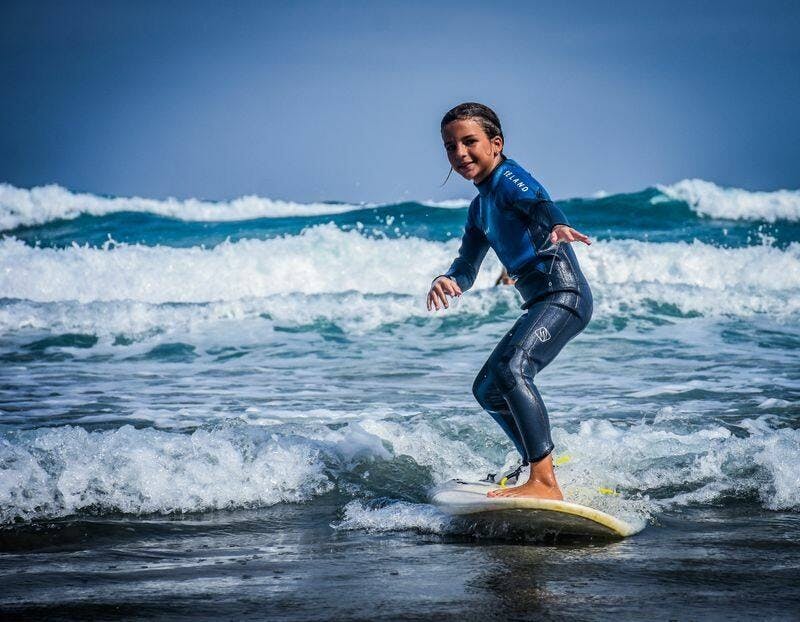 Family surfing session in the south of Fuerteventura