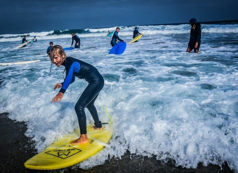 Family surfing session in the south of Fuerteventura