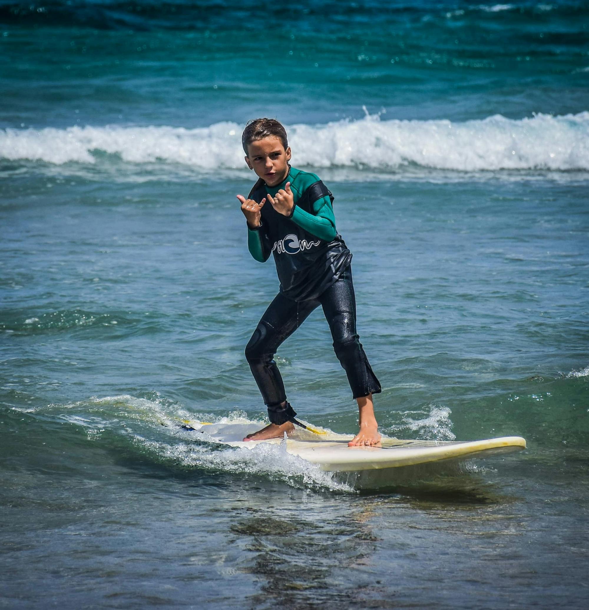 Family surfing session in the south of Fuerteventura