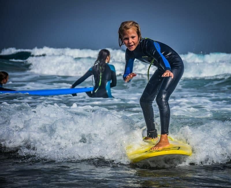 Family surfing session in the south of Fuerteventura