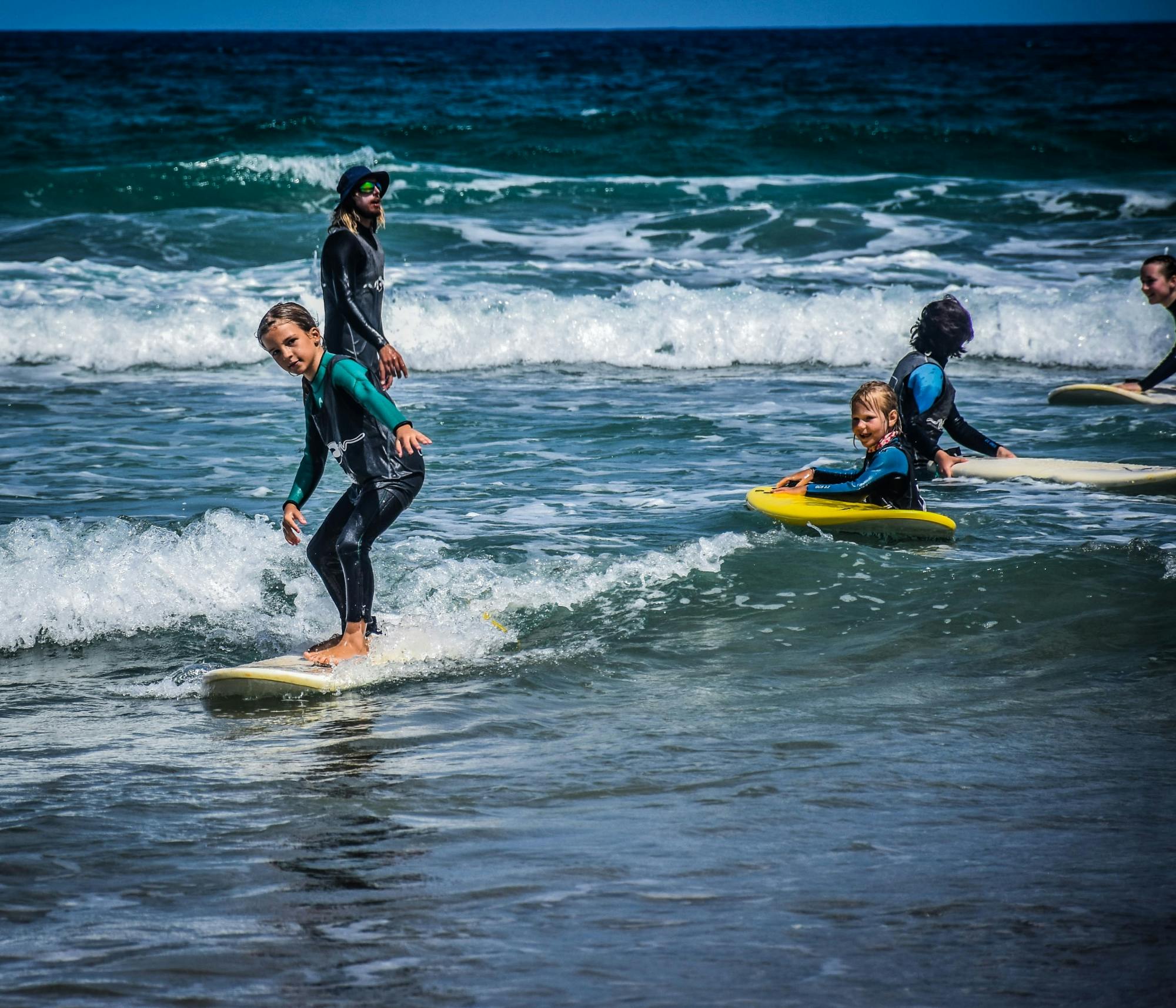 Family surfing session in the south of Fuerteventura