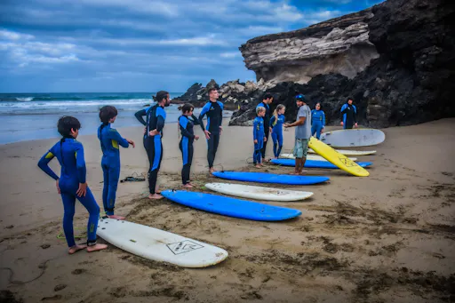 Family surfing session in the south of Fuerteventura