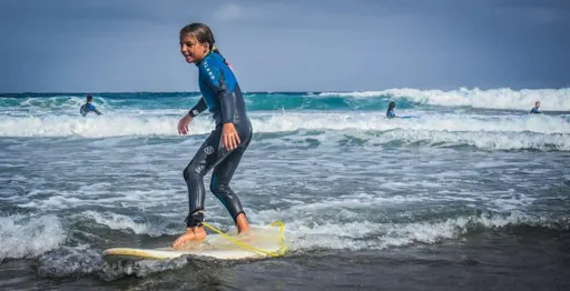 Family surfing session in the south of Fuerteventura