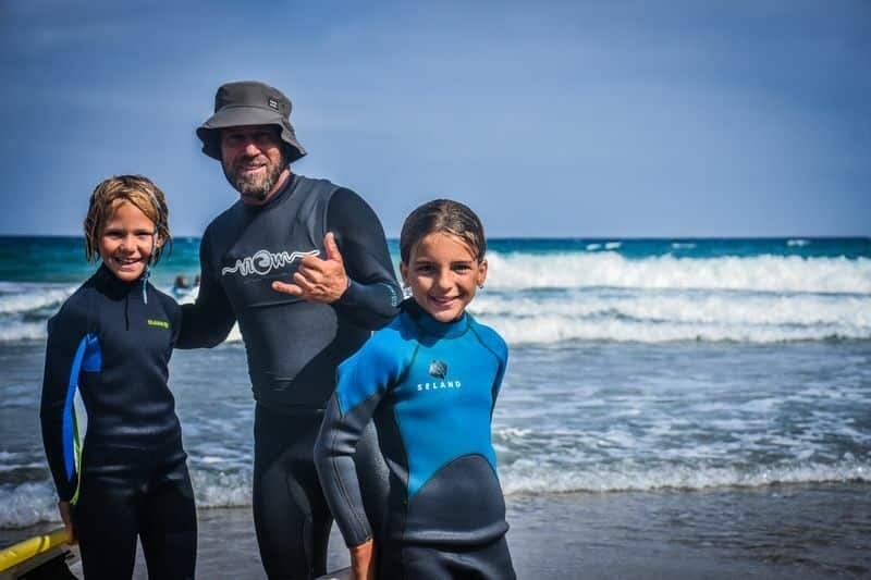 Family surfing session in the south of Fuerteventura