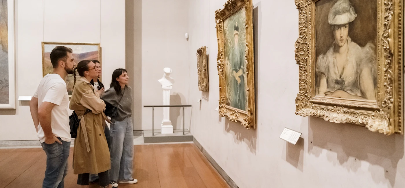 Visitors viewing paintings inside the Lyon Museum of Fine Arts