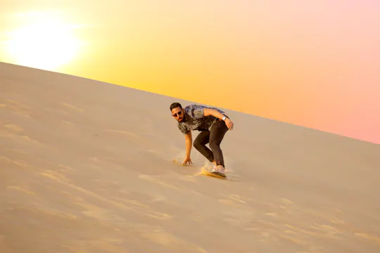 Abu Dhabi sunrise desert adventure with dune bashing and camel ride