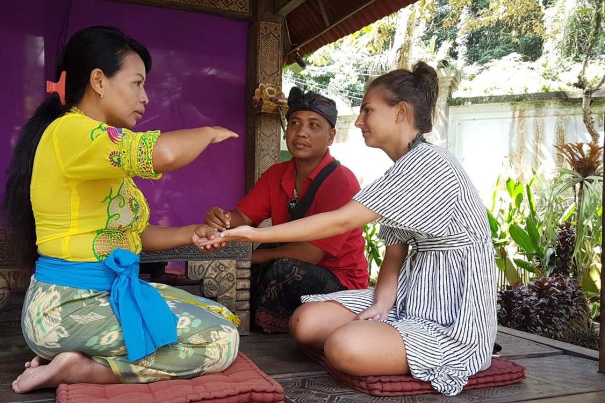 Sunrise yoga, holy bathing and palm reading experience in Bali