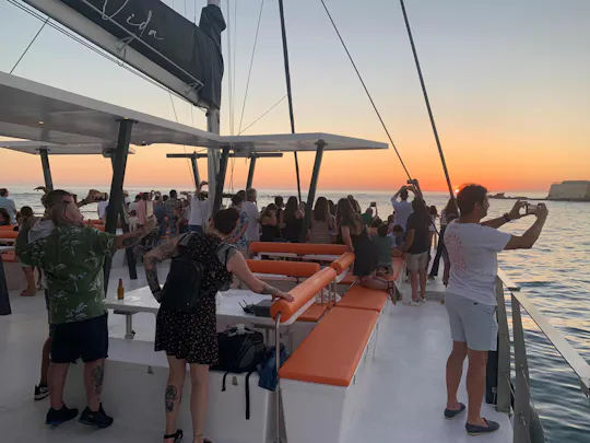 Boottocht bij zonsondergang met saxofoon en een drankje