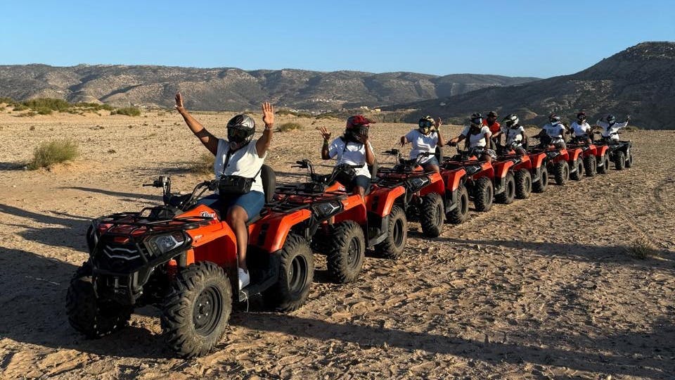 Quad biking, sandboarding and sunset camel ride with barbecue