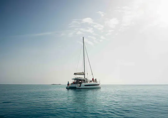 Sardinian coastline catamaran tour with multiple stops